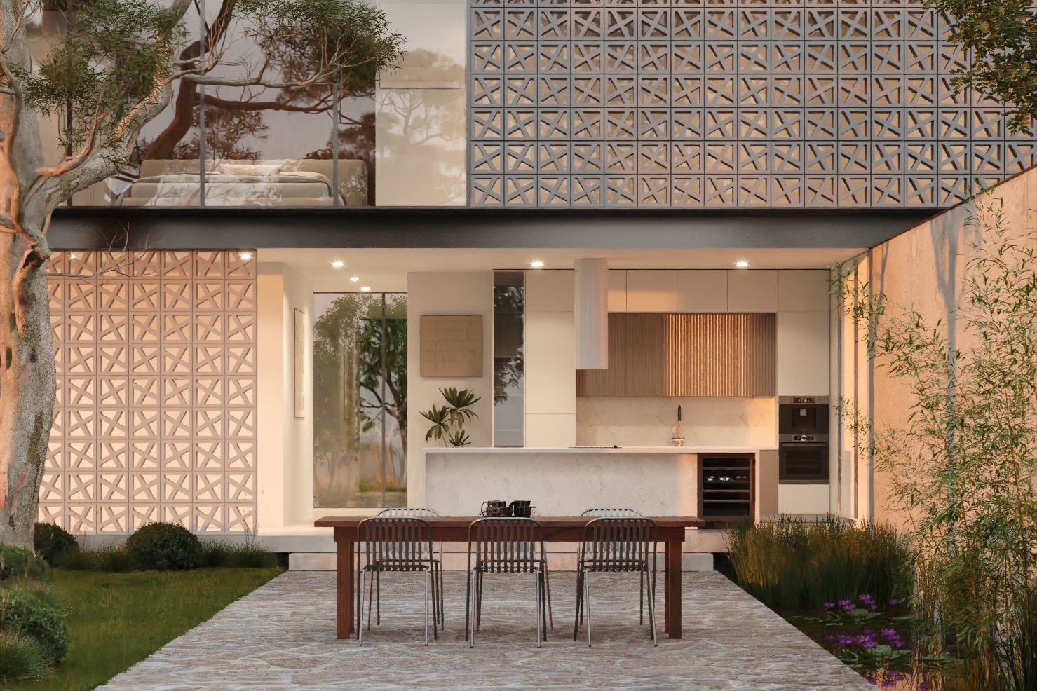 View of kitchen beyond outdoor dining courtyard with breeze blocks above on the first floor of new house construction.